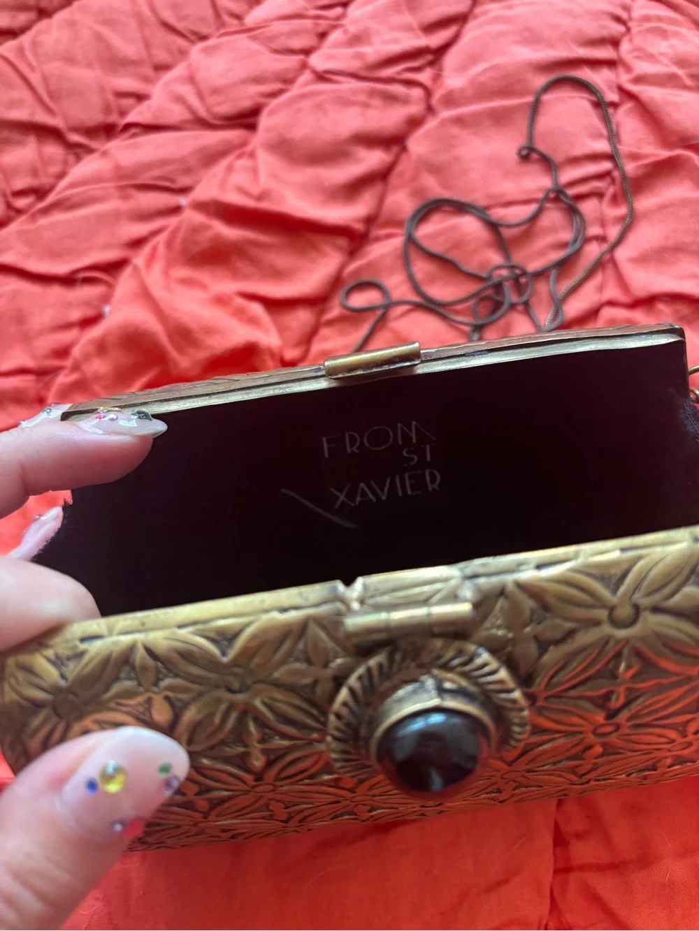 From St. Xavier Floral Metal Clutch in Bronze with Decorative Stone Accent